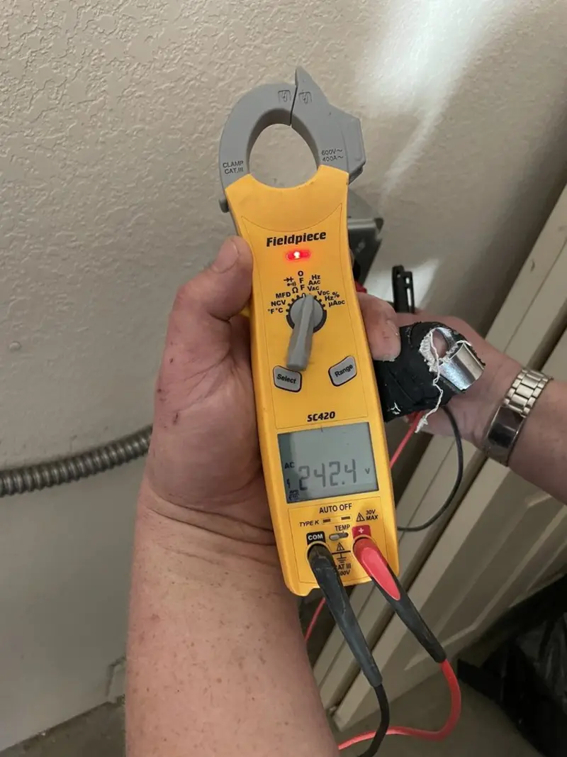 Voltage testing with clamp meter during Recessed Lighting Installation in Ponchatoula